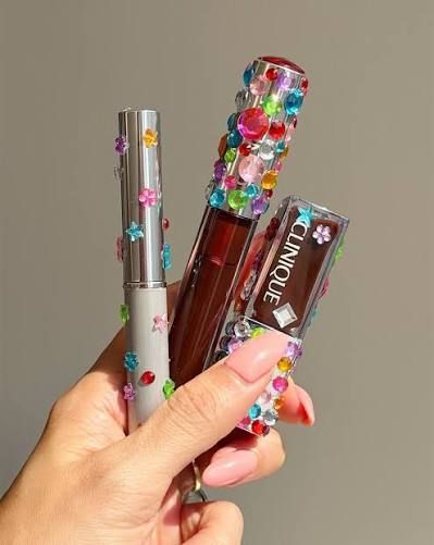 Rhinestone-embellished Clinique lip gloss and beauty tools inspired by the whimsy marketing trend